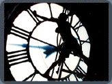 Car-uhl Oil grapples with the interior of a translucent clock face inside the Buffalo Train Terminal.